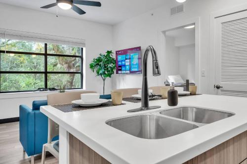 a kitchen with a sink and a counter top at The Well 206 in Zephyrhills