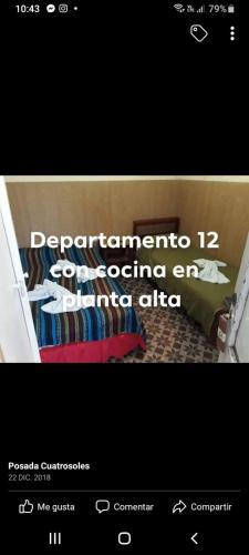 a page of a website with a picture of a bed at Hotel Andrea in Mar del Plata