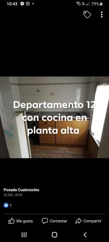 a screenshot of a website with a sign for a bathroom at Hotel Andrea in Mar del Plata