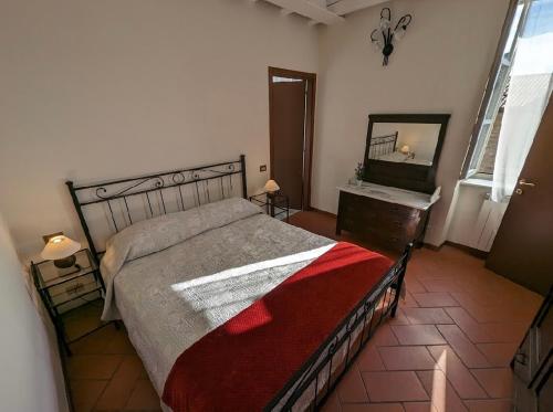 Tempat tidur dalam kamar di Casa vacanze Rasetto