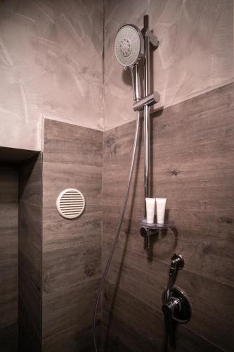 a shower with a shower head in a bathroom at La Casa di Saretta in Terlizzi