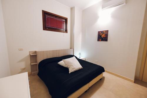Postel nebo postele na pokoji v ubytování Verso Oriente