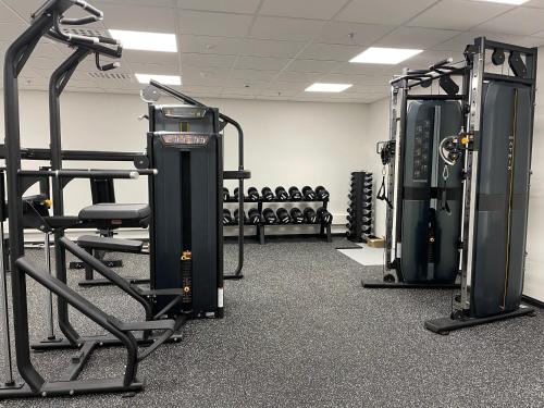 a gym with several treadmills and tread machines at Levi Cranberry C1, ski-in ski-out 2 bedroom apartment in Levi center in Levi
