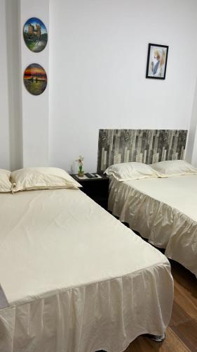 Ένα ή περισσότερα κρεβάτια σε δωμάτιο στο CASA SHILCAYO Habitaciones Vacacionales