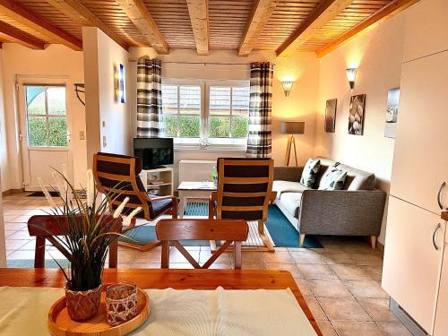 a living room with a couch and a table at Ferienhäuser Liethmann Haus 4 W1 in Timmendorf