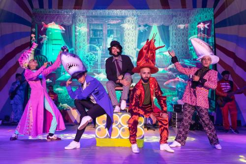 a group of people dancing on a stage at Bahia Principe Grand Tulum - All Inclusive in Akumal