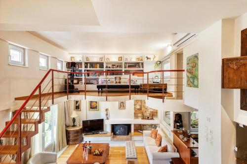 a large living room with a spiral staircase at Artistic Villa Luxury in Athens