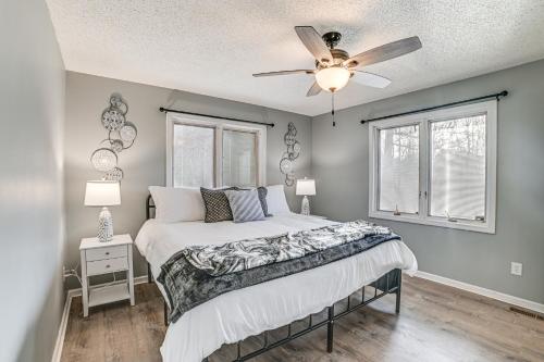 a bedroom with a bed and a ceiling fan at Quiet Tennessee Getaway about 12 Mi to Kentucky Lake! in Paris