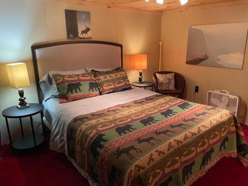 a bedroom with a bed and two lamps at Restful Retreat in Grantsburg