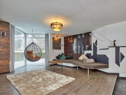 Posezení v ubytování Adler Chalet in Längenfeld