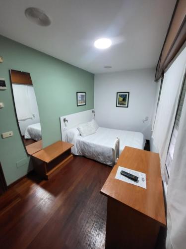 Postel nebo postele na pokoji v ubytování Hostal La Frontera