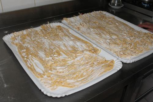 two uncooked pizzas sitting on top of a counter at Residence La Piscina in Isola del Gran Sasso dʼItalia