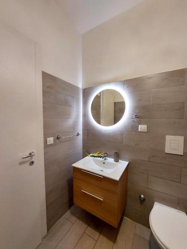 a bathroom with a sink and a mirror at Moonlight Sorrento Studios in Sorrento