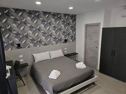 Ένα ή περισσότερα κρεβάτια σε δωμάτιο στο B&B Napoli Mitologica