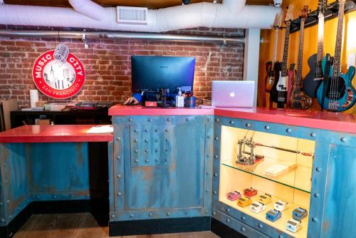a blue bar with a red counter and a clock at Music City Hotel - Home of the San Francisco Music Hall of Fame in San Francisco