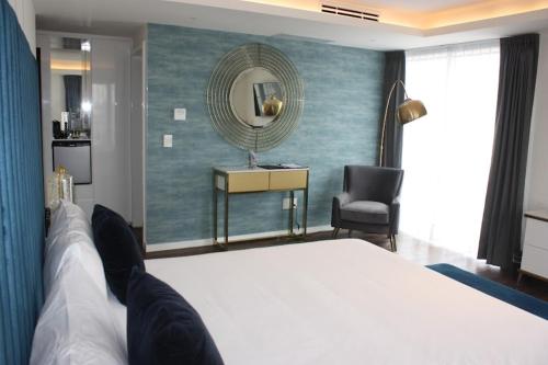 Кровать или кровати в номере Casa Cuarzo Hotel Boutique
