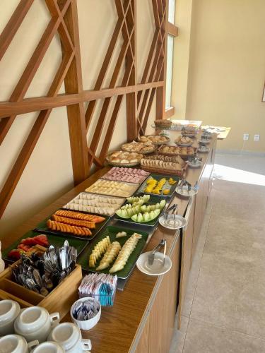 a buffet line with many different types of food at Makia Beach Experience By All in Porto De Galinhas