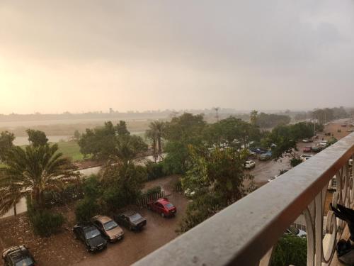 a view of a parking lot with cars parked at القاهره ركن حلوان شارع الشهيد in ‘Ezbet el-Auqât