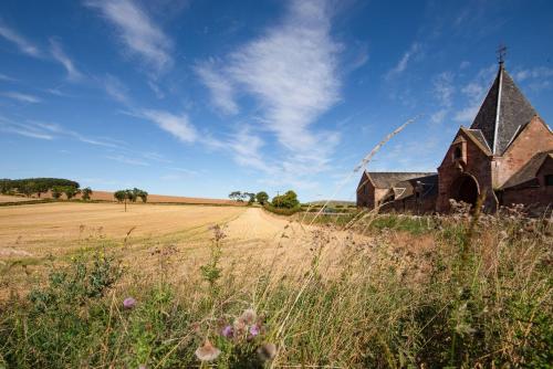 an old church in the middle of a field at Ploughman's Bothy at Papple Steading in East Linton