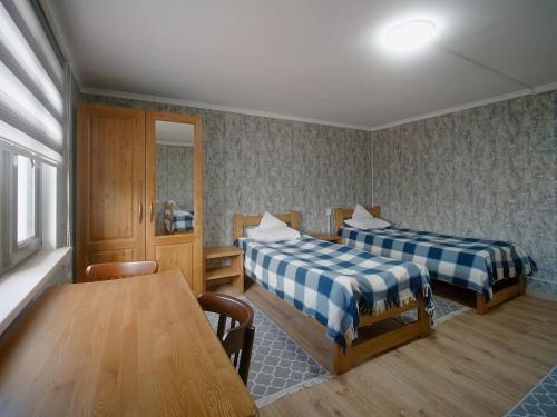 Postel nebo postele na pokoji v ubytování Guesthouse Alakol