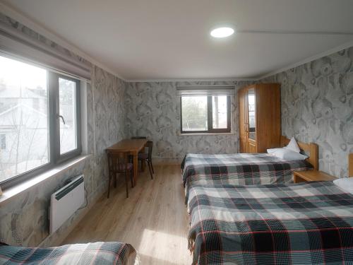 Postel nebo postele na pokoji v ubytování Guesthouse Alakol