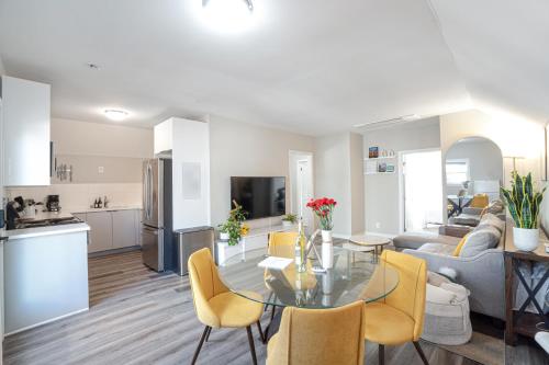 a kitchen and a living room with a table and chairs at Perfect Workation Spot, Fast Wi-Fi, Fully Stocked in Seattle