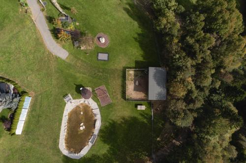 an overhead view of a yard with a house at Panoramahotel Huberhof in Maranza