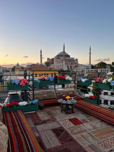 a view of a city with flowers on a balcony at Henna Hotel Istanbul in Istanbul