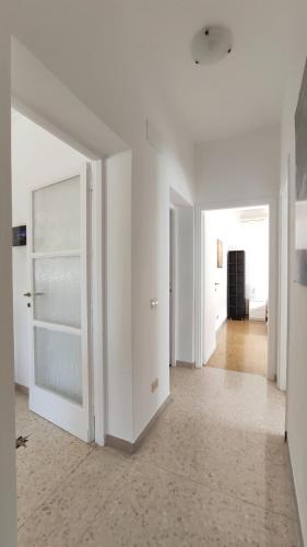 an empty room with white walls and a hallway at Wyndcliffe in Anzio