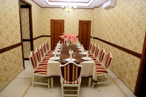 a long dining room with a long table and chairs at BeSt Hotel and Restaurant complex in Dunaivtsi