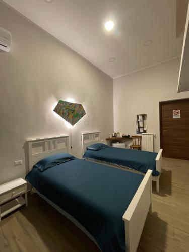 מיטה או מיטות בחדר ב-Casa AGNESE B&B