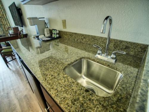a kitchen counter with a stainless steel sink at Treasure Bay Resort & Marina in St Pete Beach
