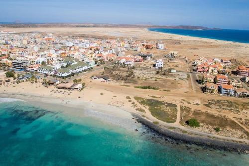 an aerial view of a beach with a city at A Sunrise Haven with Panoramic Ocean Views in Santa Maria