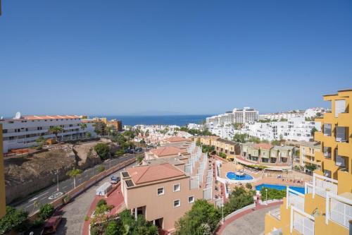 arial view of a city with a pool and buildings at Orlando 85 Complex - Costa Adeje in Adeje