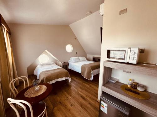 Postel nebo postele na pokoji v ubytování Hotel Casona Los Colonos