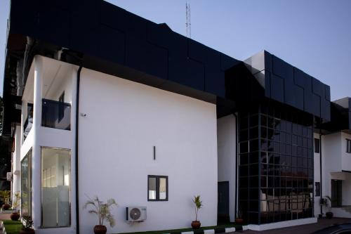 a modern house with a black roof at Portland Suites in Abuja