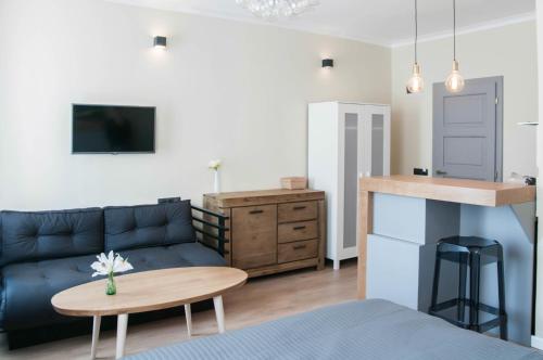 a living room with a couch and a table at Cluj Napoca Apartments in Cluj-Napoca