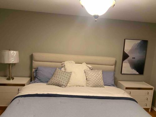 A bed or beds in a room at Lovely Home Away Near YYZ Airport