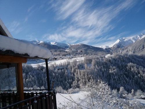 a view of a snow covered mountain from a house at LES HIRONDELLES in Les Orres