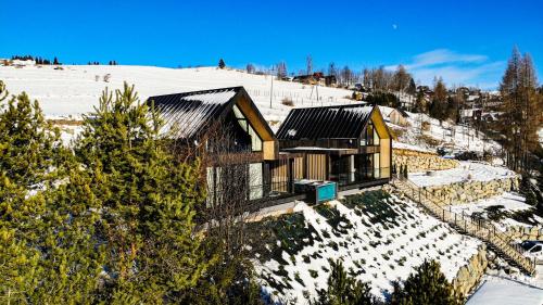 a house on top of a snow covered mountain at RzepiskaView in Rzepiska