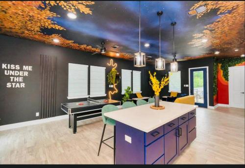 a room with a kitchen with a table and chairs at CAMP OUT - Big Backyard - 5mins To Downtown in Houston