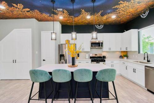 a kitchen with a table with four chairs at CAMP OUT - Big Backyard - 5mins To Downtown in Houston