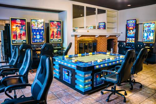 a video game room with a table and chairs at Inn at York in York