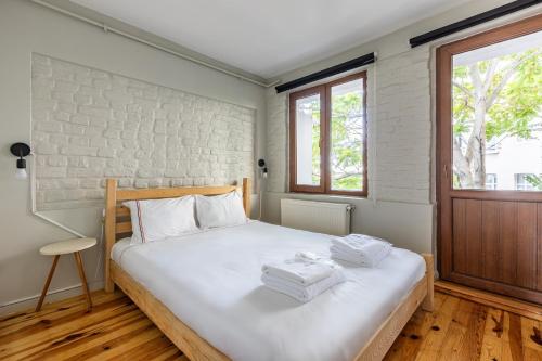 a bedroom with a bed with towels on it at Pin Exclusive 1 BD Taksim A5 in Istanbul