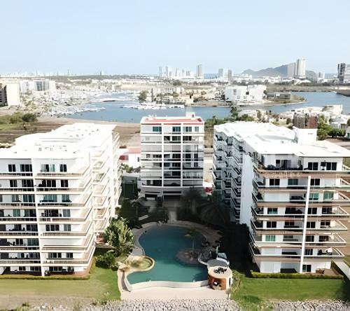an aerial view of apartment buildings and a body of water at Pacifika Marina Mazatlán in Mazatlán