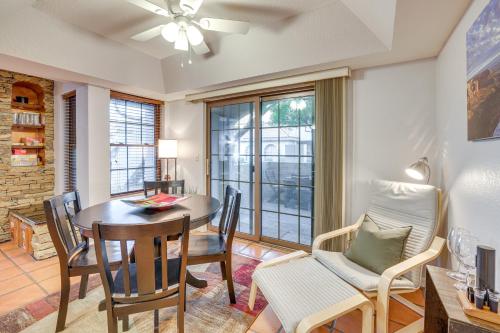a dining room with a table and chairs and a window at Walk to Park Scottsdale Condo with Community Pool! in Scottsdale