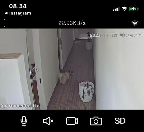 a screenshot of a room with a hallway with a floor at NOVO APARTAMENTO Liz 3 in Porto Seguro