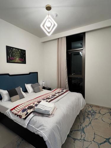 a bedroom with a large bed in a room at Brand New 1BHK Near Burj Khalifa-Burj Crown tower in Dubai