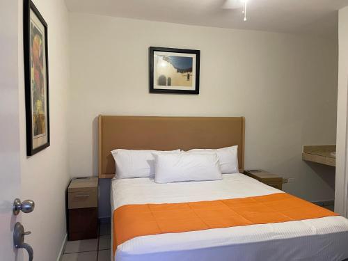 Katil atau katil-katil dalam bilik di HOTEL LAS PALMAS