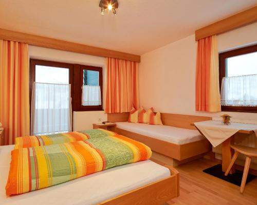 Katil atau katil-katil dalam bilik di Ferienhaus Frühlingsheim